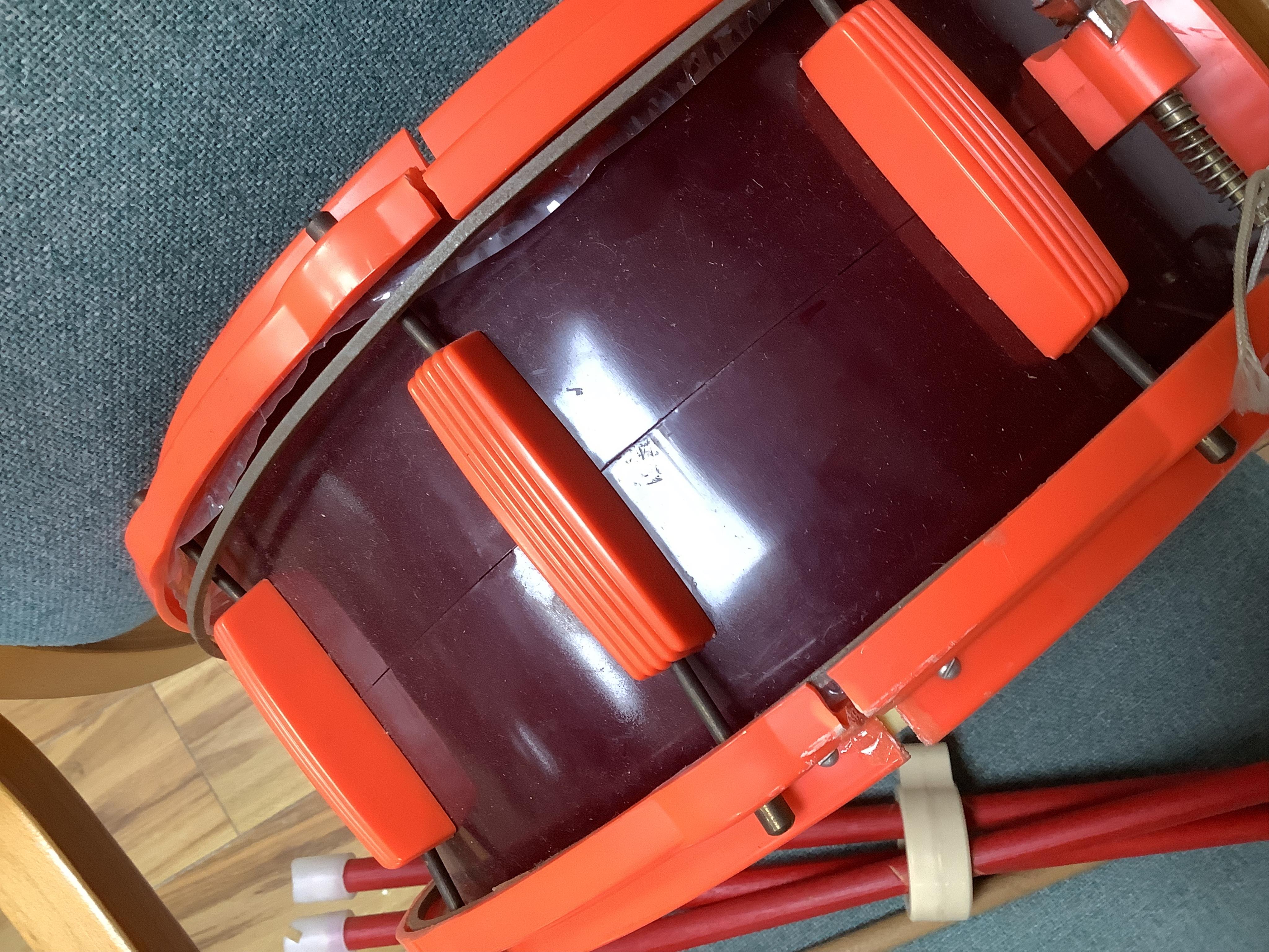 A 1960's Beatles child's plastic drum set in the original card box comprising of a snare drum on a stand, a card cut out bust of Ringo Starr, two 1960s Beatles jigsaws (unchecked) and a Beatles inflatable ball